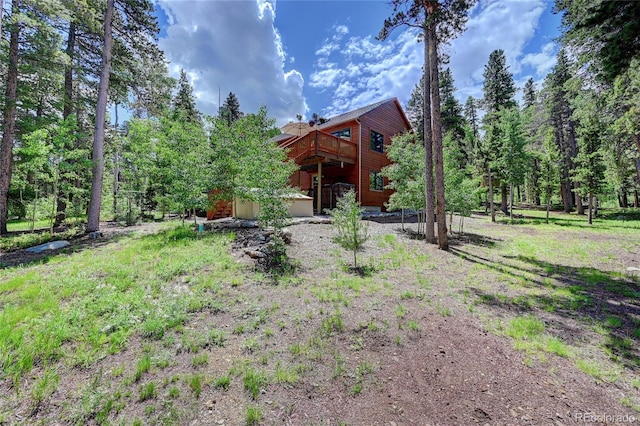 view of yard featuring a wooden deck