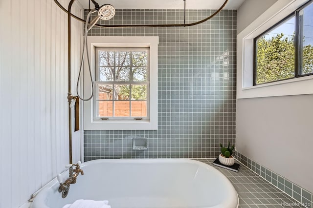 full bathroom with a soaking tub