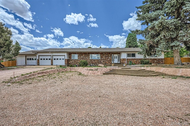 single story home featuring a garage