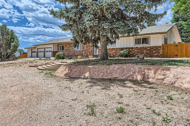 single story home with a garage