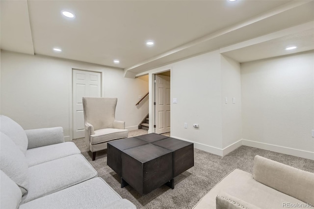 living area with carpet floors, recessed lighting, baseboards, and stairs