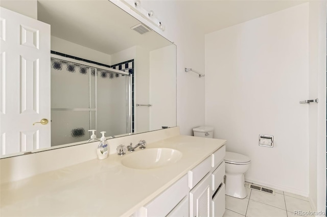 bathroom featuring visible vents, a shower with door, toilet, and tile patterned floors