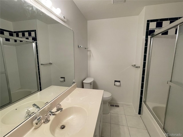 bathroom featuring toilet, shower / bath combination with glass door, tile patterned flooring, and visible vents