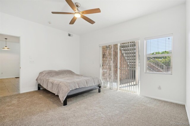 2502 S Bahama Cir Unit B, Aurora, CO 80013 - bedroom featuring carpet, access to exterior, ceiling fan, and baseboards