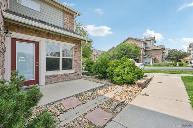 2502 S Bahama Cir Unit B, Aurora, CO 80013 - view of side of property with stone siding