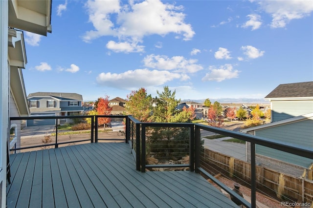 wooden deck featuring a residential view