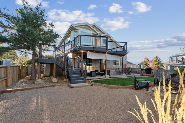 exterior space featuring a fenced backyard, a patio, and stairway