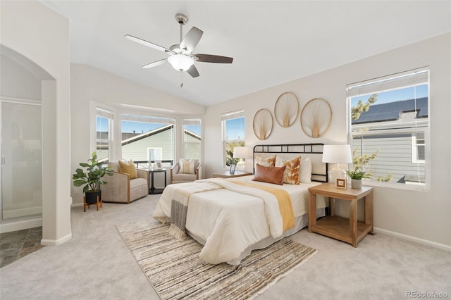 bedroom with light carpet, vaulted ceiling, and multiple windows