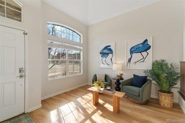 sitting room with light wood-style flooring and baseboards