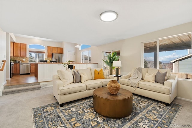 living area with carpet floors and baseboards