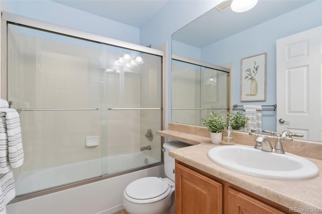 bathroom with toilet, visible vents, combined bath / shower with glass door, and vanity