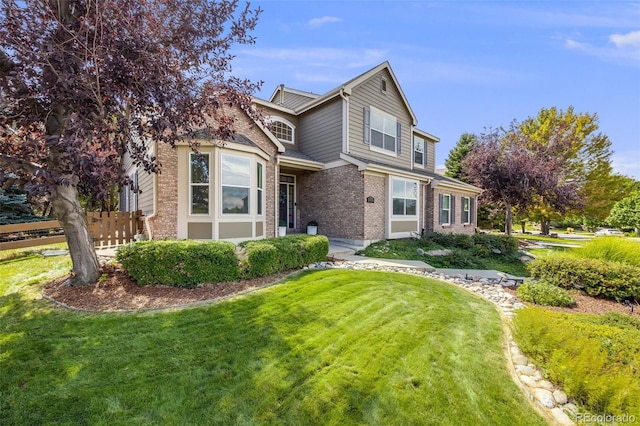 front facade featuring a front lawn