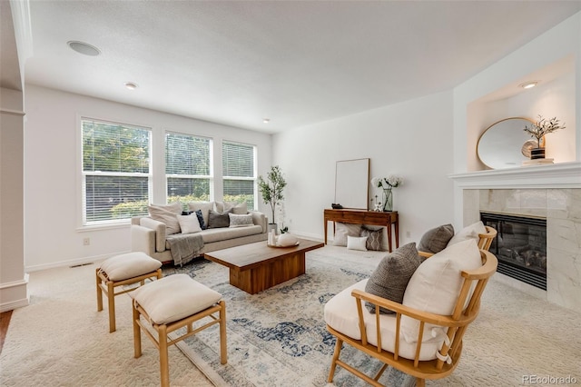 carpeted living room with a fireplace