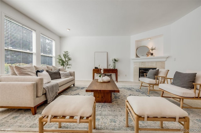 living room with a tiled fireplace