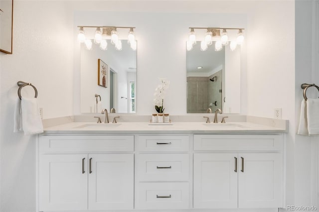 bathroom with vanity and a tile shower