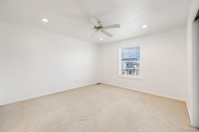 unfurnished room featuring carpet and ceiling fan