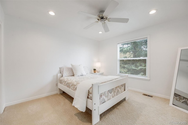 carpeted bedroom with ceiling fan