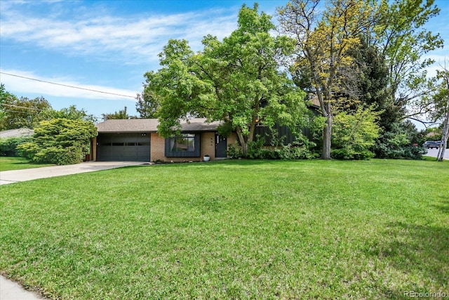 400 S Hoyt St, Lakewood, CO 80226 - view of front of house with driveway, a garage, a front lawn, and brick siding