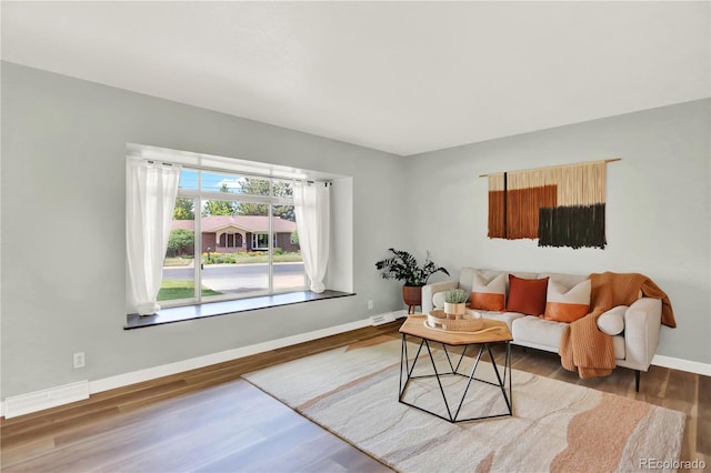 400 S Hoyt St, Lakewood, CO 80226 - living area featuring baseboards and wood finished floors