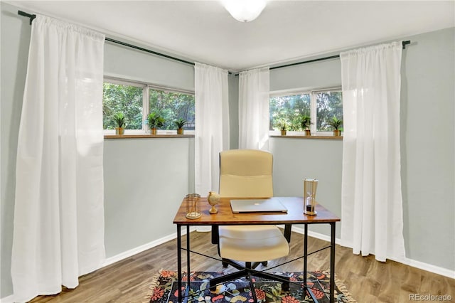 400 S Hoyt St, Lakewood, CO 80226 - home office featuring healthy amount of natural light, wood finished floors, and baseboards
