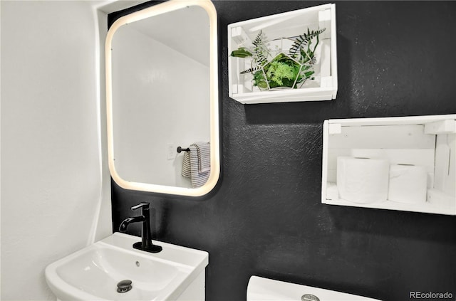 400 S Hoyt St, Lakewood, CO 80226 - bathroom with a sink and a textured wall
