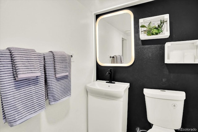 400 S Hoyt St, Lakewood, CO 80226 - bathroom featuring toilet and vanity