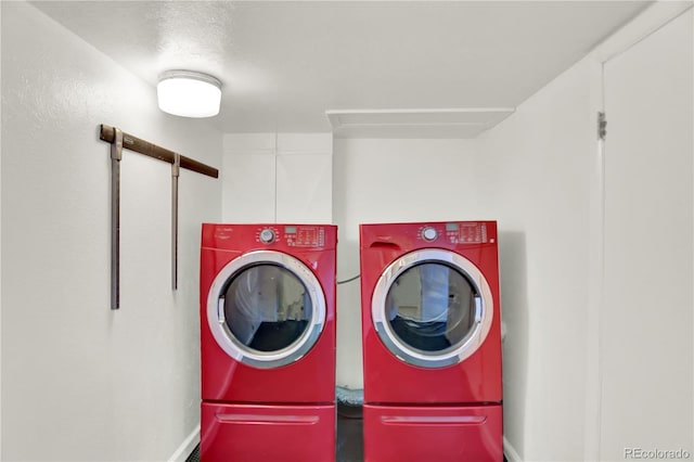 400 S Hoyt St, Lakewood, CO 80226 - laundry room with washing machine and dryer and baseboards