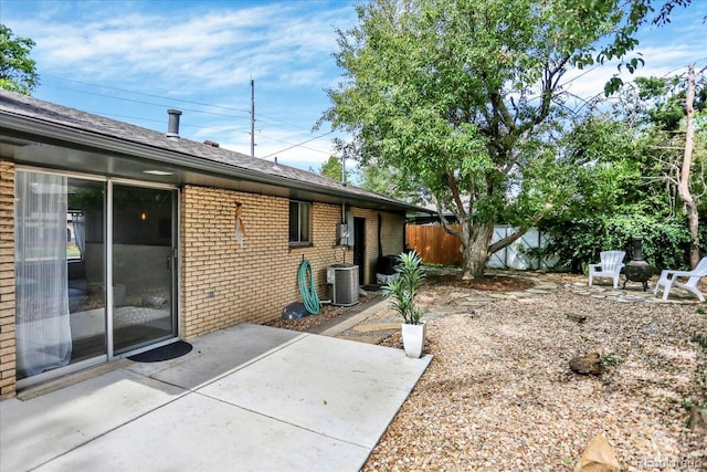 400 S Hoyt St, Lakewood, CO 80226 - rear view of property with brick siding, a patio area, and cooling unit