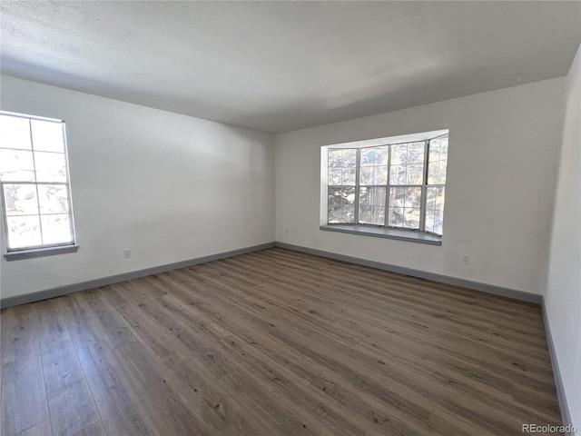 empty room featuring dark hardwood / wood-style floors