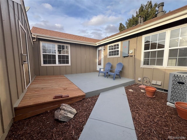 view of patio / terrace with a deck and central air condition unit