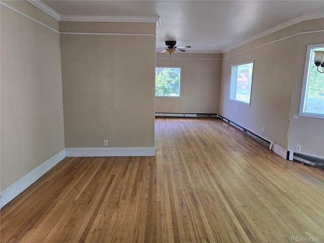 104 Joe S Chavez Dr, La Jara, CO 81140 - empty room featuring plenty of natural light, a ceiling fan, wood finished floors, and ornamental molding