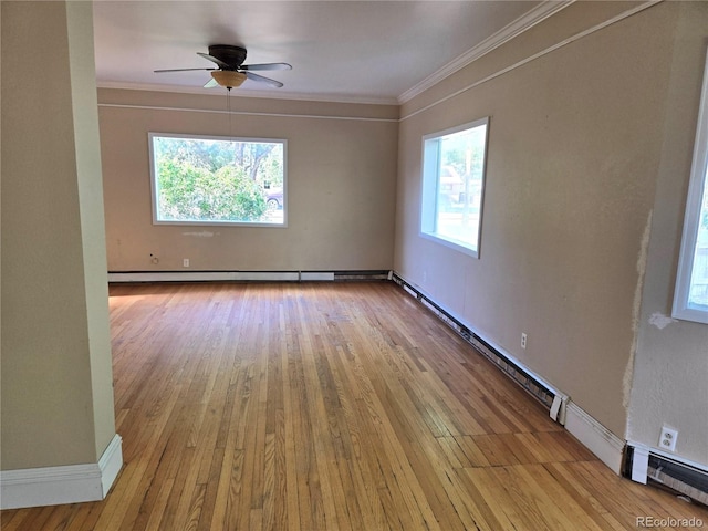 104 Joe S Chavez Dr, La Jara, CO 81140 - spare room featuring hardwood / wood-style flooring, ornamental molding, baseboard heating, and ceiling fan