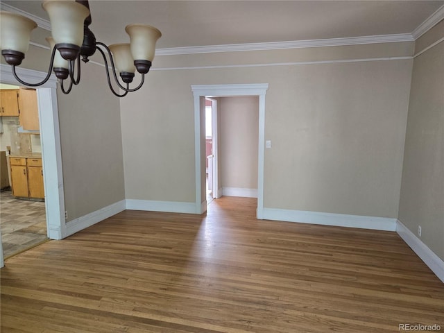 104 Joe S Chavez Dr, La Jara, CO 81140 - unfurnished dining area with a chandelier, crown molding, and light wood-type flooring