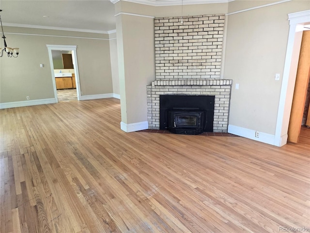 104 Joe S Chavez Dr, La Jara, CO 81140 - unfurnished living room featuring light wood-style floors, a chandelier, and ornamental molding