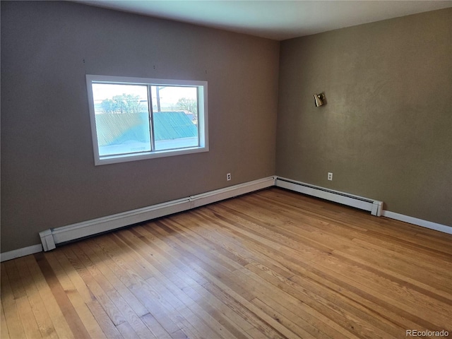 104 Joe S Chavez Dr, La Jara, CO 81140 - unfurnished room with hardwood / wood-style flooring and a baseboard heating unit