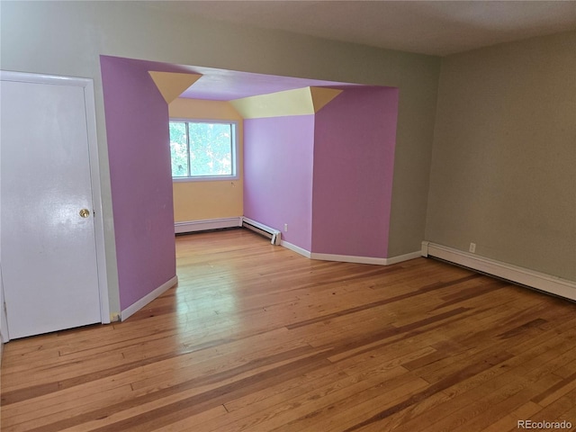 104 Joe S Chavez Dr, La Jara, CO 81140 - bonus room with light wood-type flooring, a baseboard radiator, and a baseboard heating unit