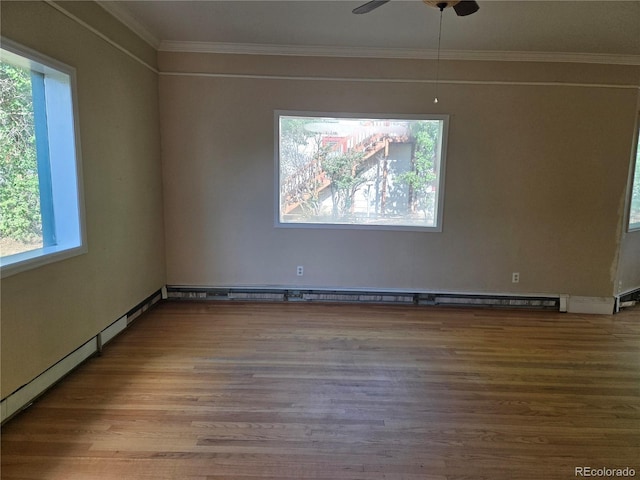 104 Joe S Chavez Dr, La Jara, CO 81140 - unfurnished room featuring healthy amount of natural light, ornamental molding, wood finished floors, and a ceiling fan