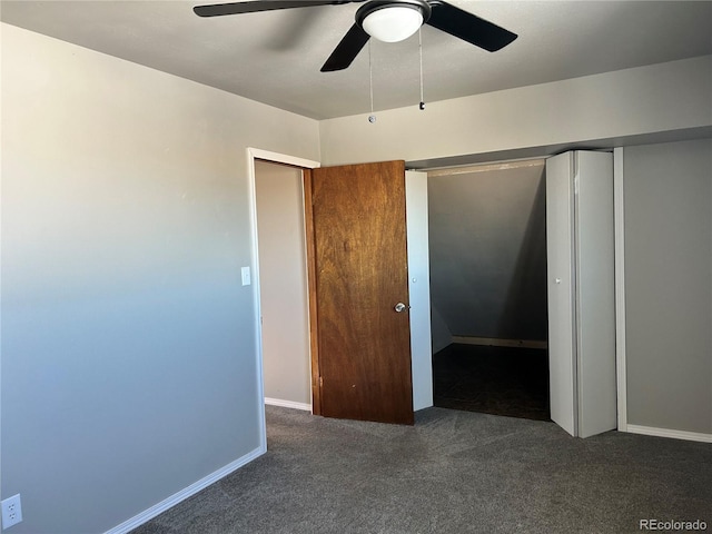 unfurnished bedroom with dark colored carpet, ceiling fan, and a closet