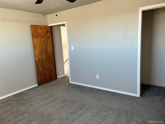 unfurnished bedroom with ceiling fan and dark carpet