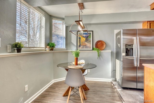 dining area with light hardwood / wood-style flooring