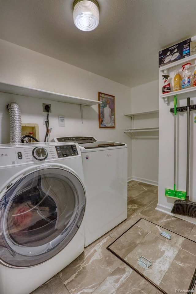 laundry room featuring washing machine and dryer