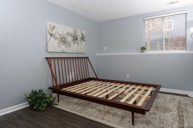 bedroom featuring dark hardwood / wood-style floors