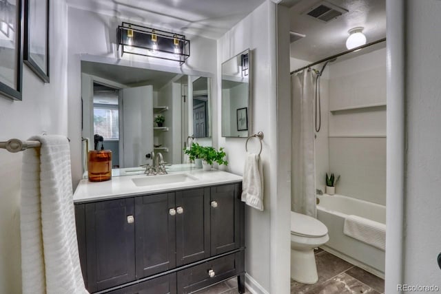 full bathroom featuring tile patterned floors, vanity, toilet, and shower / bath combo with shower curtain