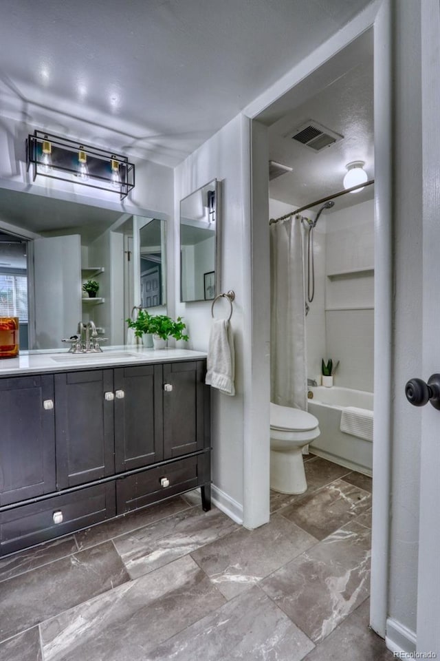 full bathroom featuring vanity, shower / bath combo, and toilet