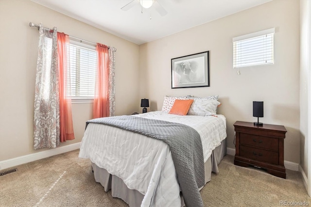 carpeted bedroom featuring ceiling fan