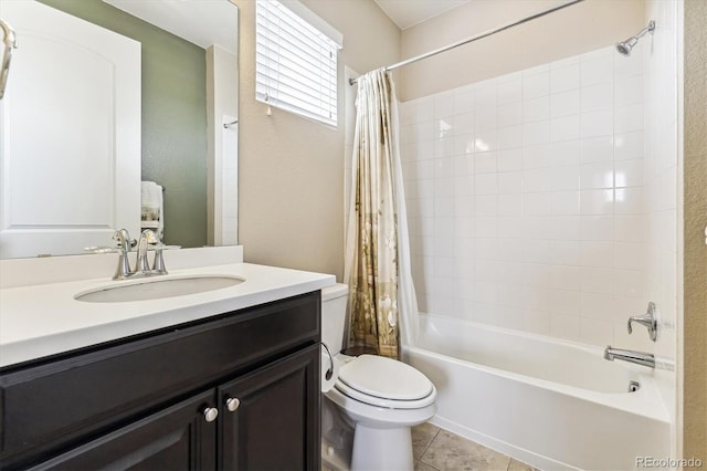 full bathroom featuring vanity, tile patterned floors, toilet, and shower / bath combo