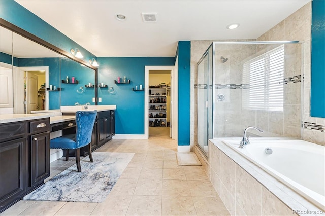 bathroom with tile patterned floors, vanity, and independent shower and bath