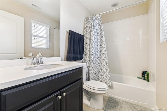 full bathroom with vanity, toilet, and shower / bath combo with shower curtain