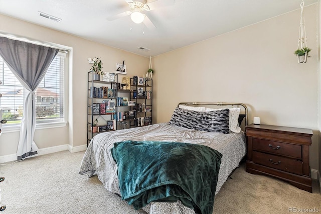 bedroom with light carpet and ceiling fan