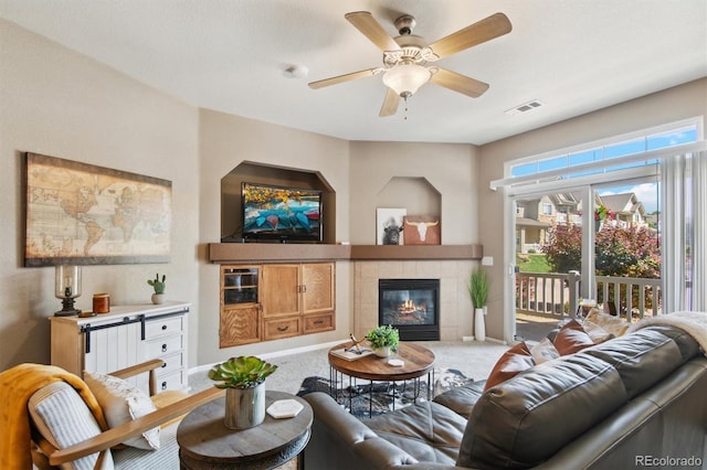 10818 Cimarron St Unit 1102, Firestone, CO 80504 - living area with a fireplace, carpet flooring, and ceiling fan